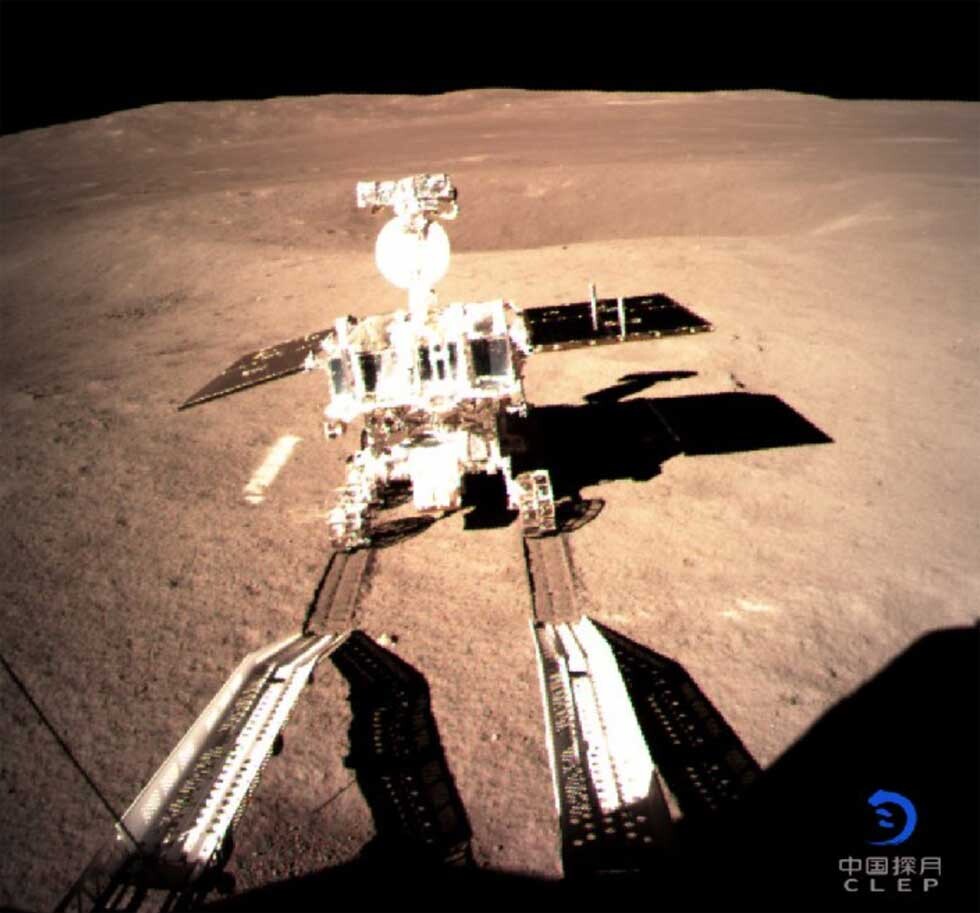 lunar rover driving down a ramp onto the moon