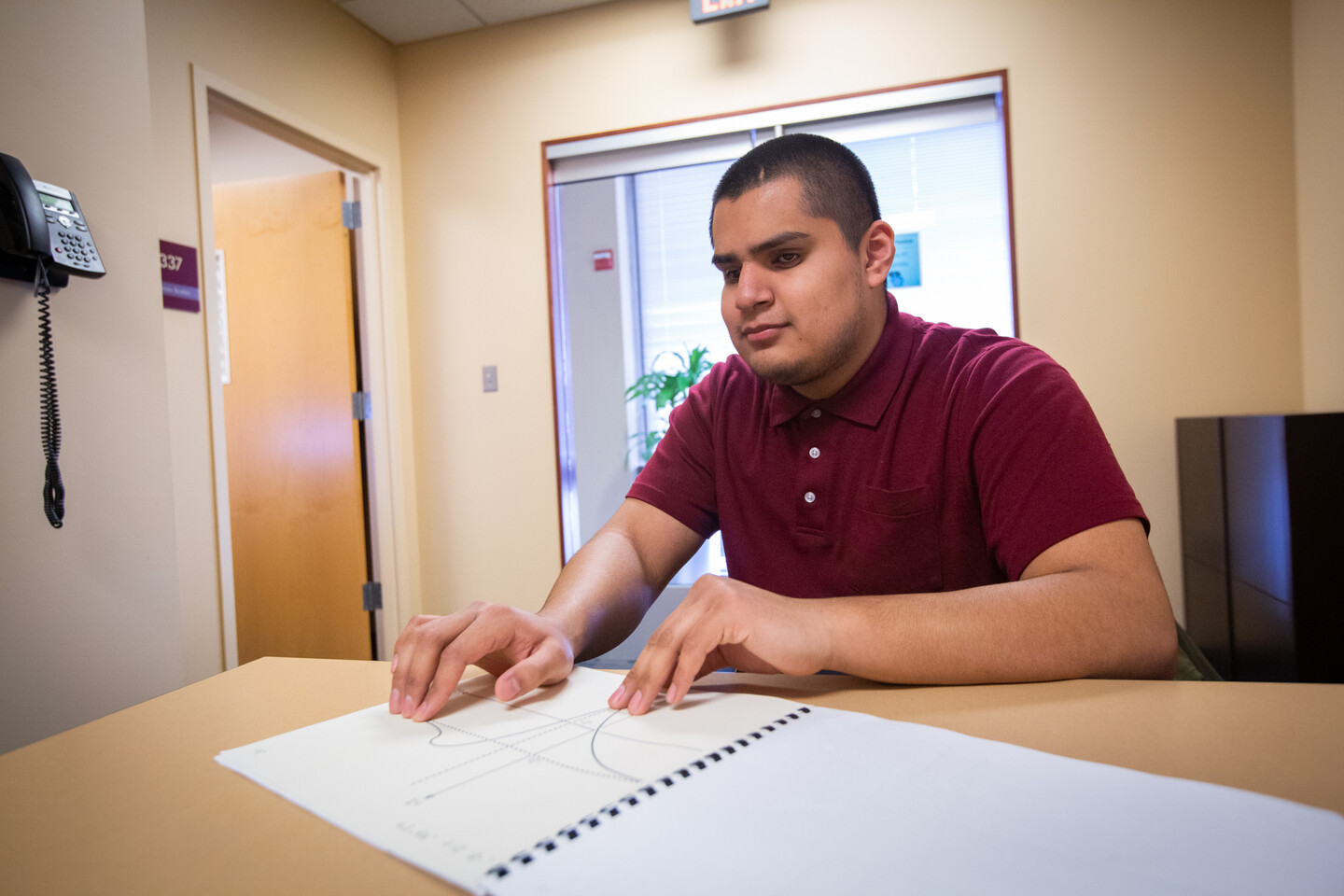 Carlos Garcia reads graph in braille