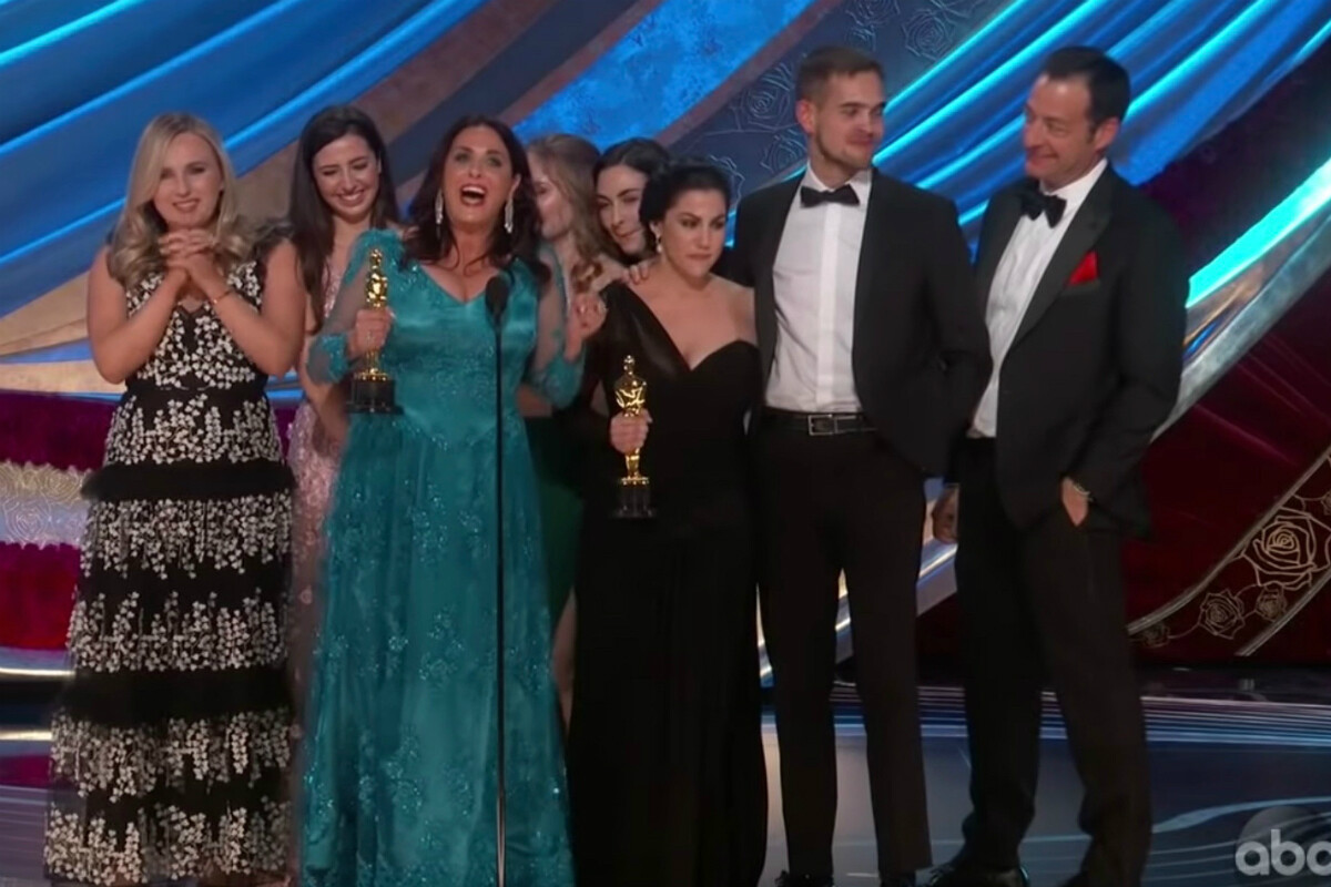 Claire Sliney on the stage at the Academy Awards with the team