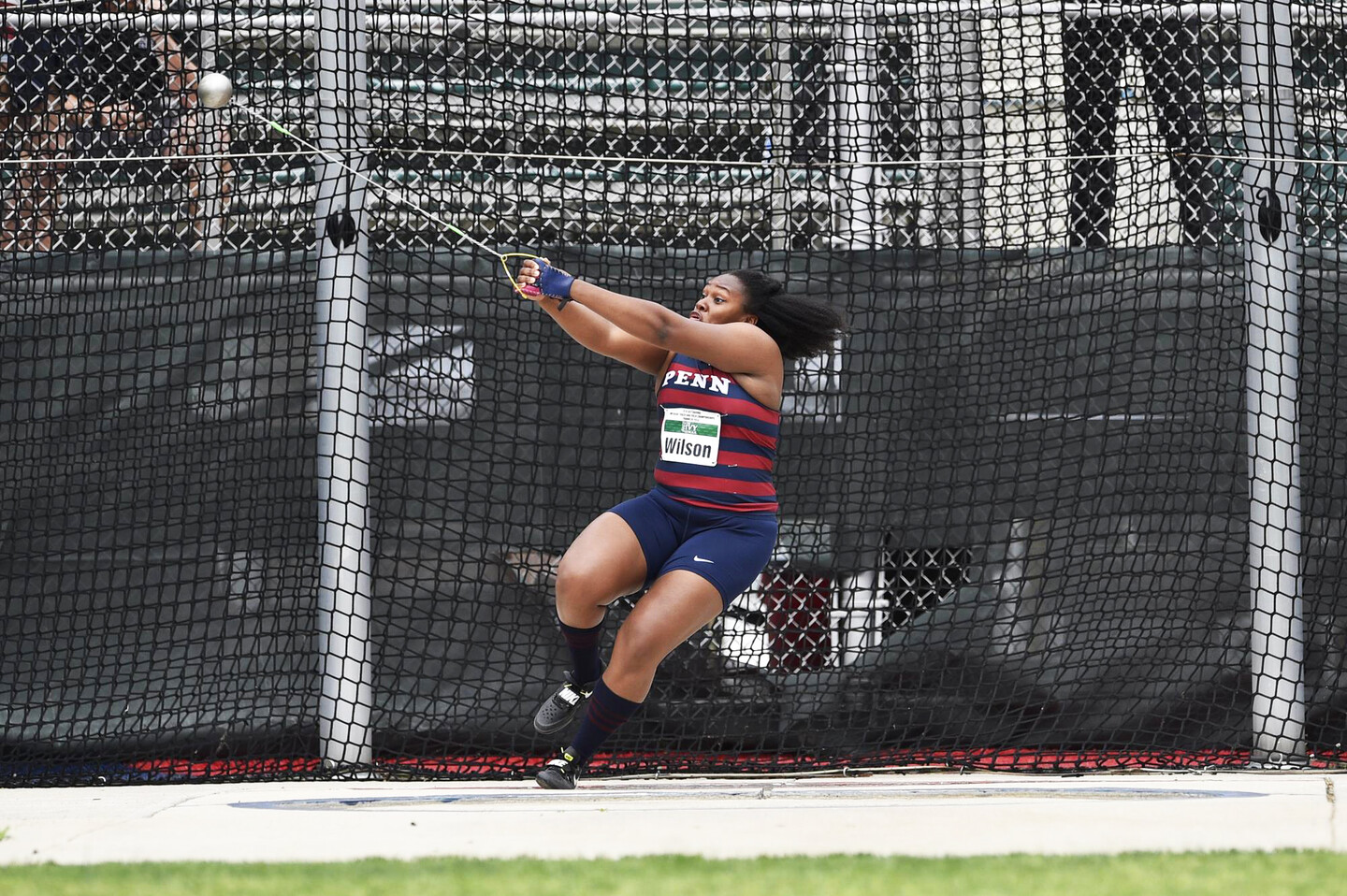 Thrower Rachel Lee Wilson does the hammer throw at a meet.