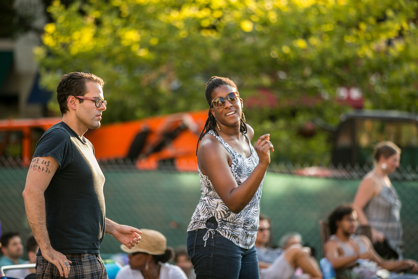 Audience member dancing with sunglasses on
