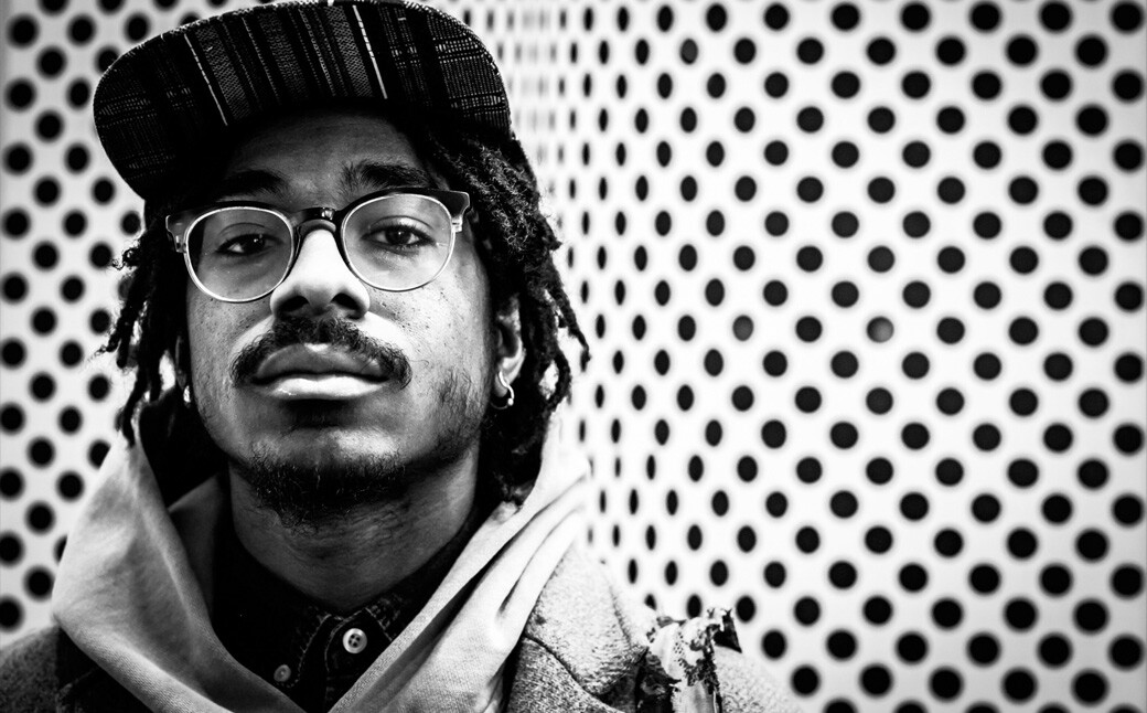 Joel Ross with black and white polka dot background