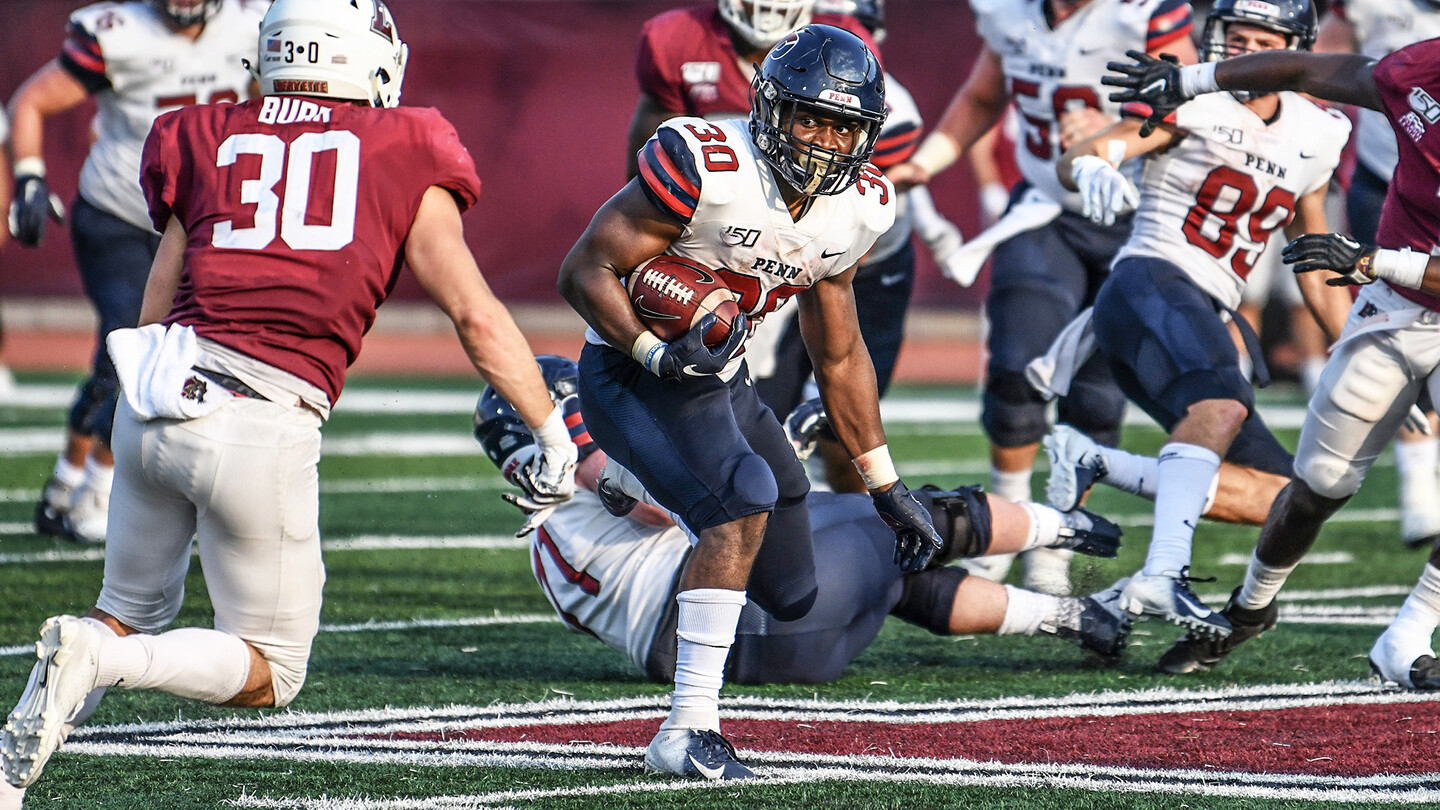 Running back Karekin Brooks runs through defenders during an away game at Lafayette.
