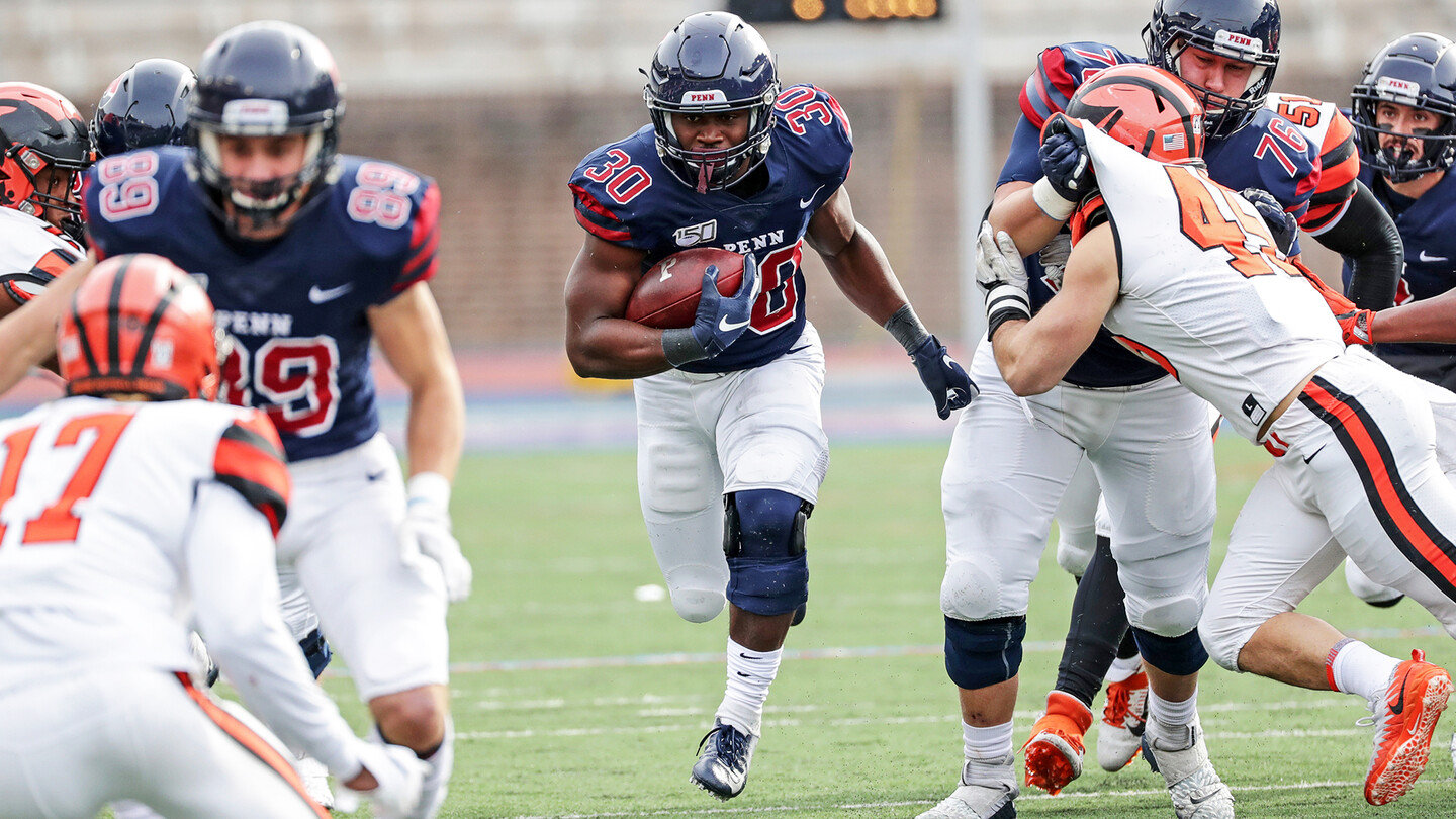 Karekin Brooks runs through a hole during a home game against Princeton.