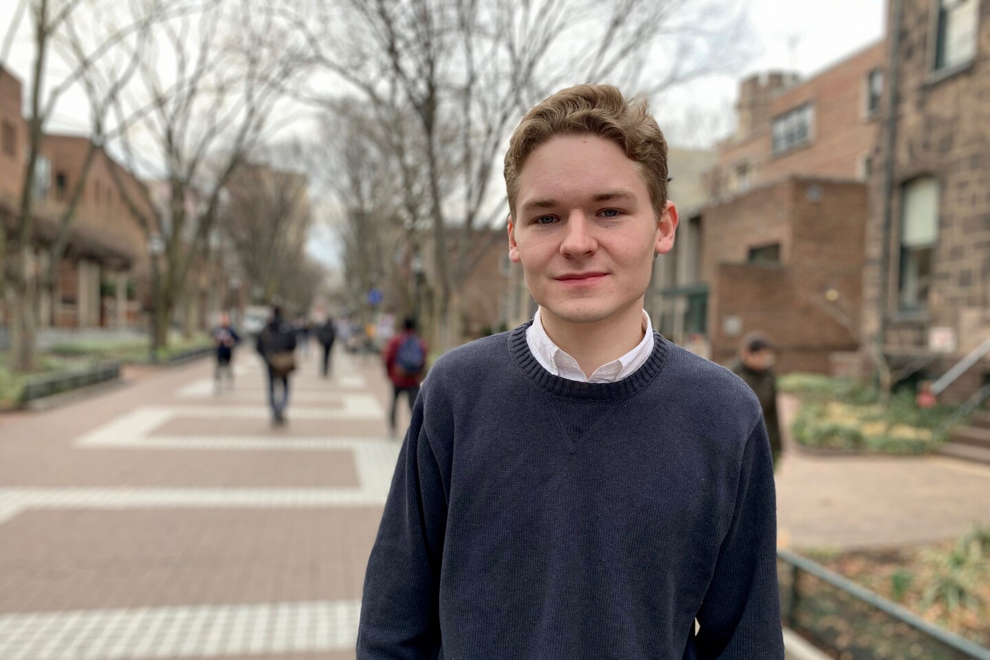 Student standing on Locust Walk 