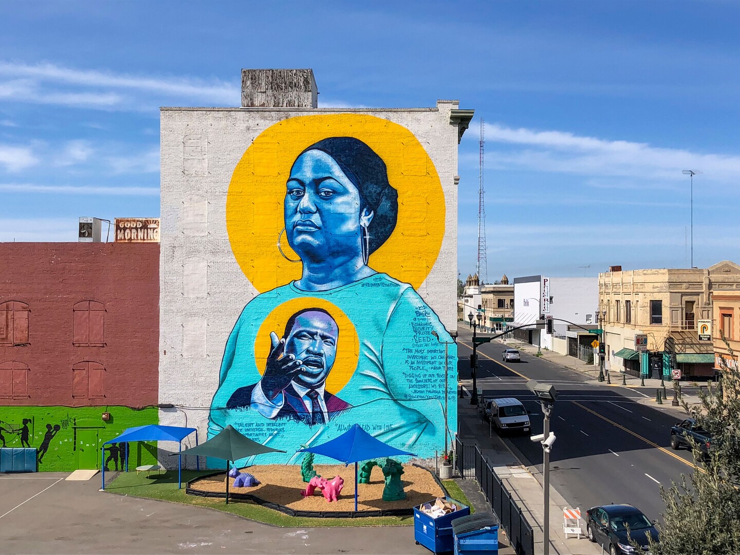Image of a 6-story building with a large mural including Dr. Martin Luther King