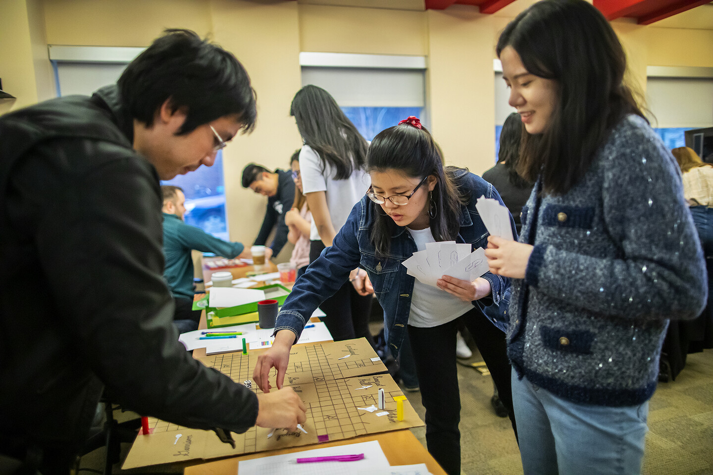 Students engaging with board games
