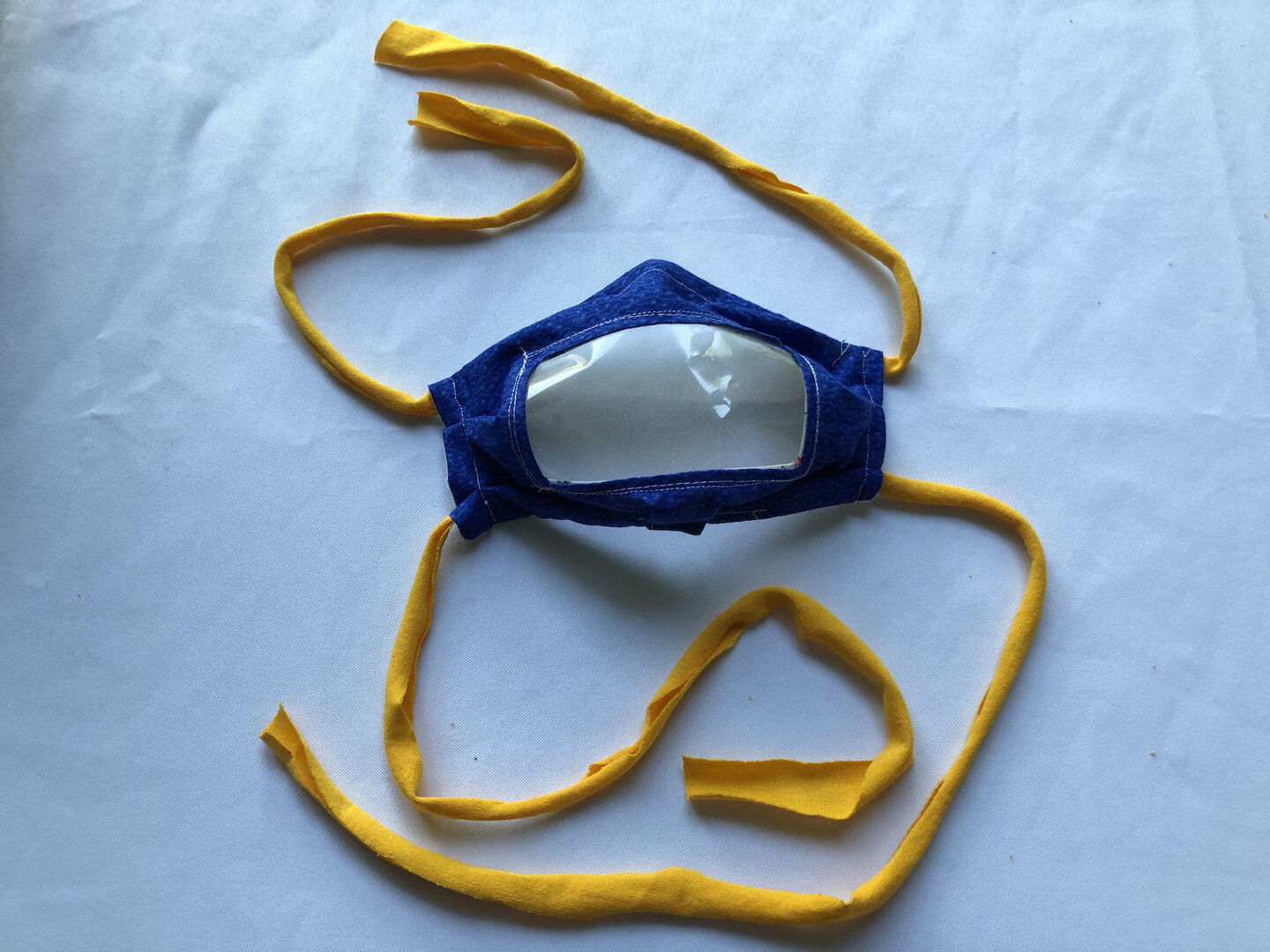 A face mask with a clear front. 