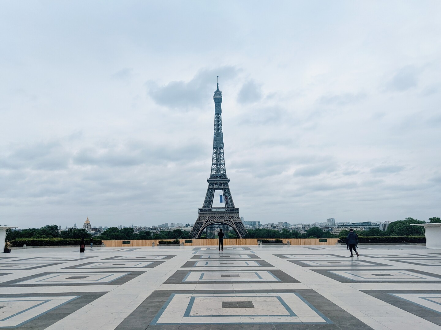 The Eiffel Tower centered, slightly off in the background. 