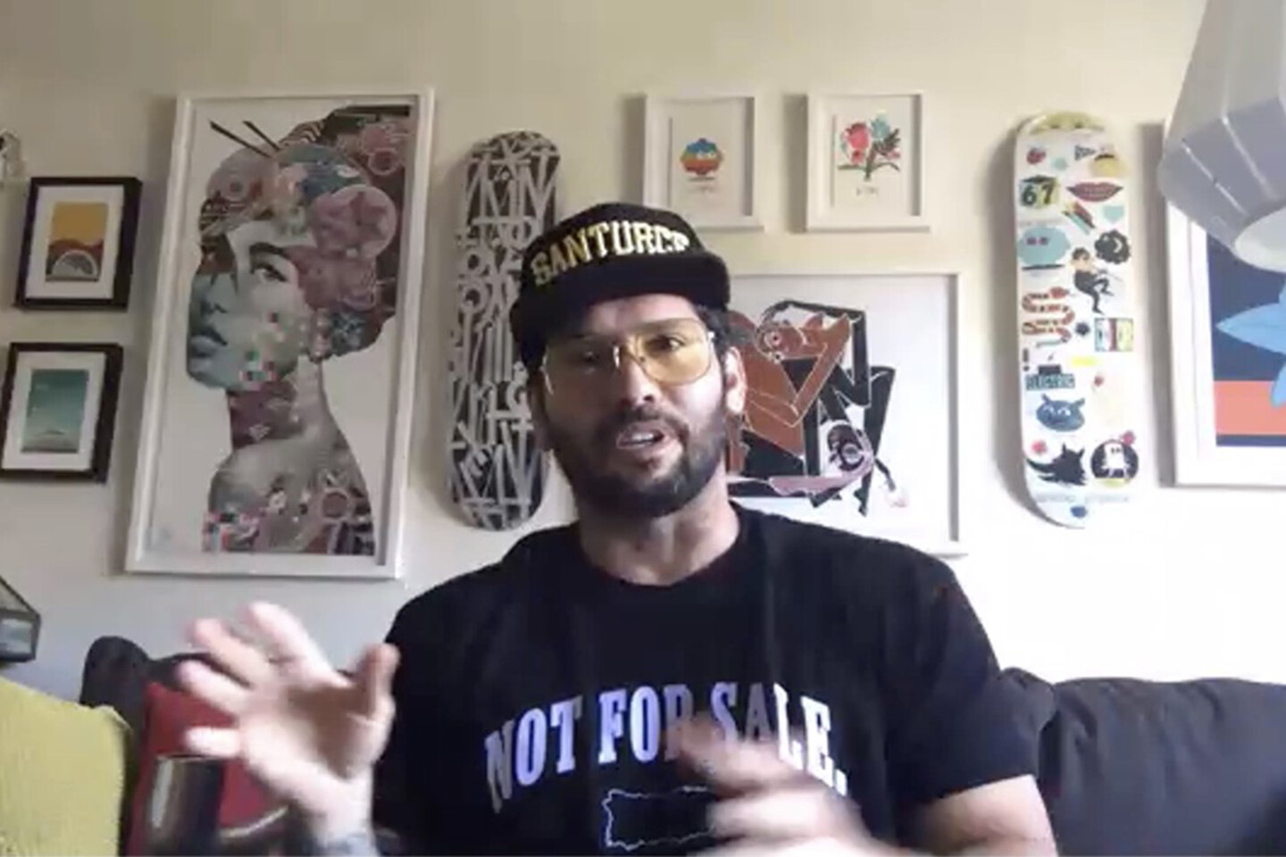 Angel Manuel Soto on his sofa speaking