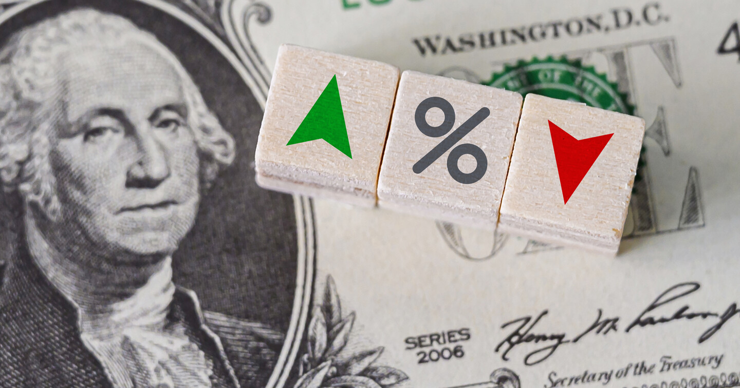 Dollar bill with blocks that convey a percentage going up or down