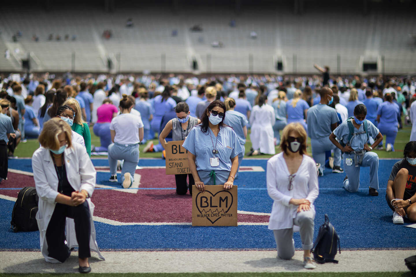 Hundreds of health care workers remembered George Floyd and other victims of police violence at a White Coats for Black Lives event on June 5 at Franklin Field.