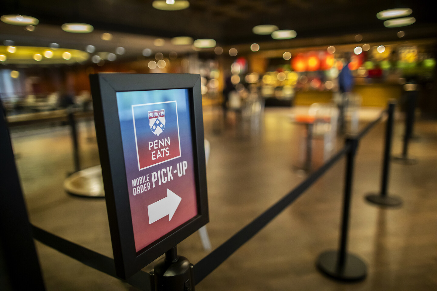 Penn Eats mobile order pick up sign at entrance to dining hall