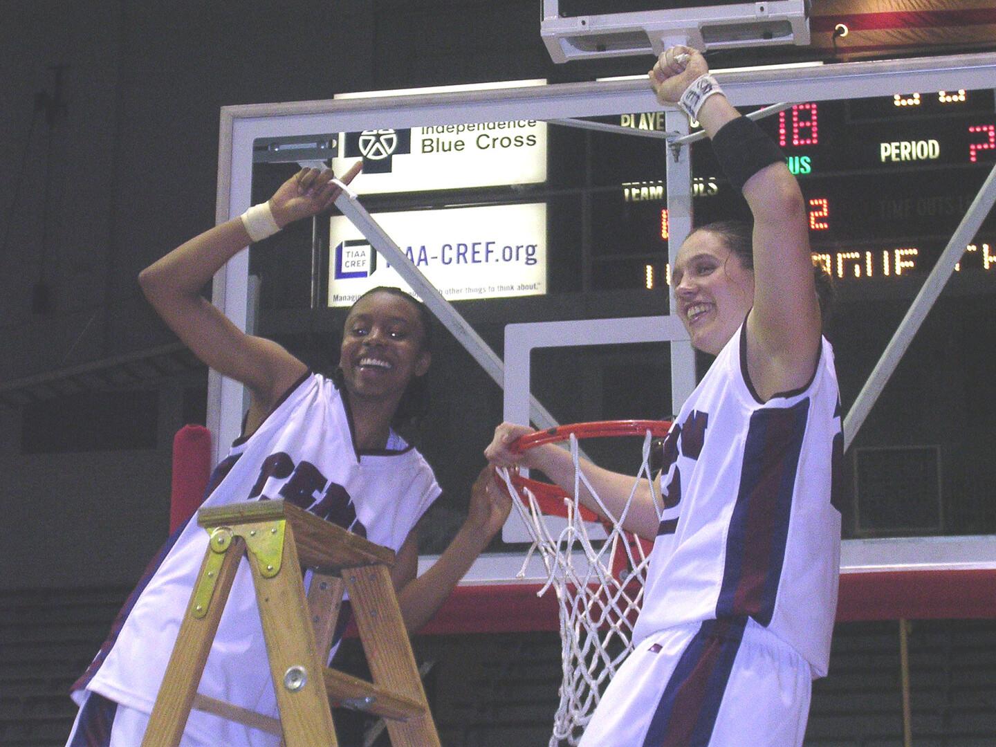 Jewel Clark and&nbsp;Mikaelyn Austin cut down the net after winning the Ivy League title at the Palestra.