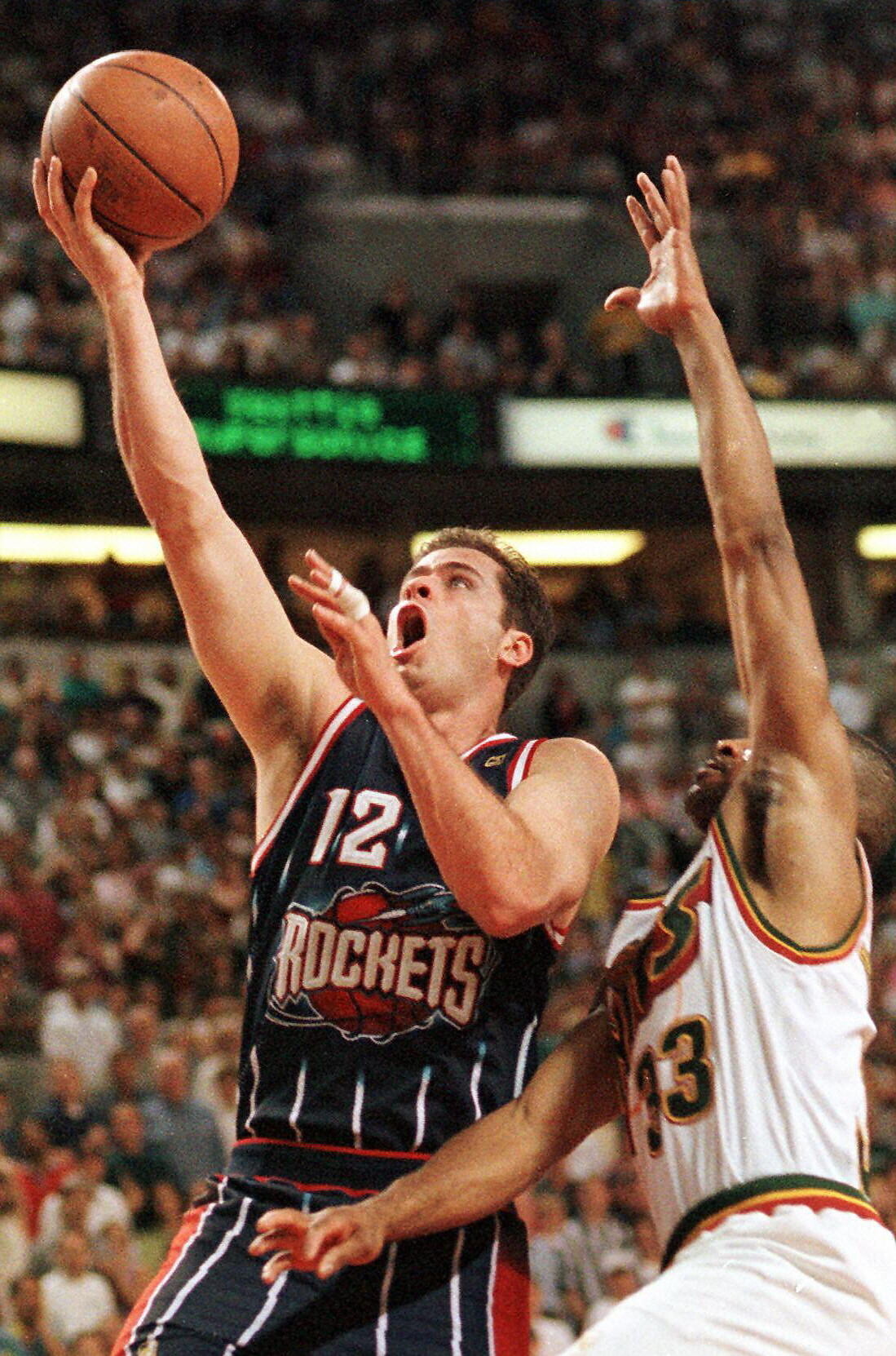 Houston Rockets guard and 1995 alumnus&nbsp;Matt Maloney goes up for the lay-up&nbsp;while playing against the Seattle Supersonics.