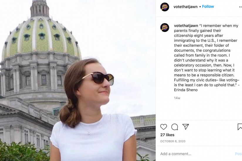 student standing in front of a domed building