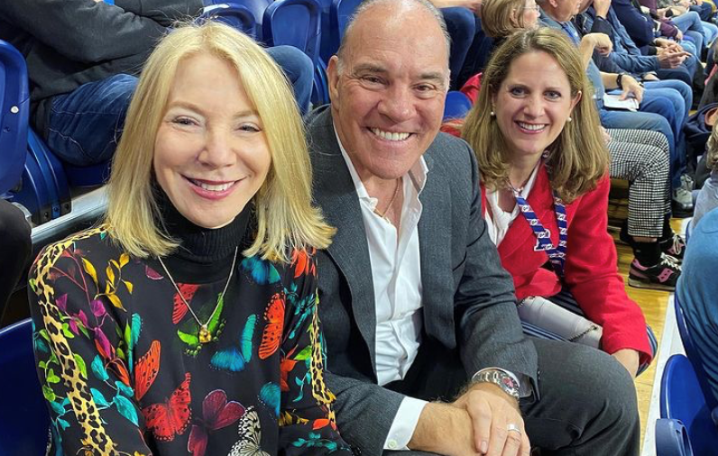 From left, President Amy Gutmann, alumnus David Pottruck, and Athletic Director M. Grace Calhoun attend a basketball game at the Palestra in January 2020.
