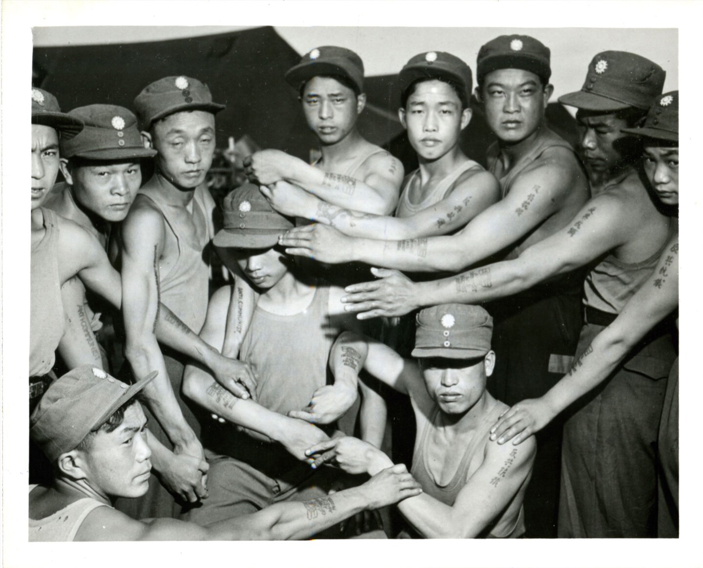 POWs show their tattoos