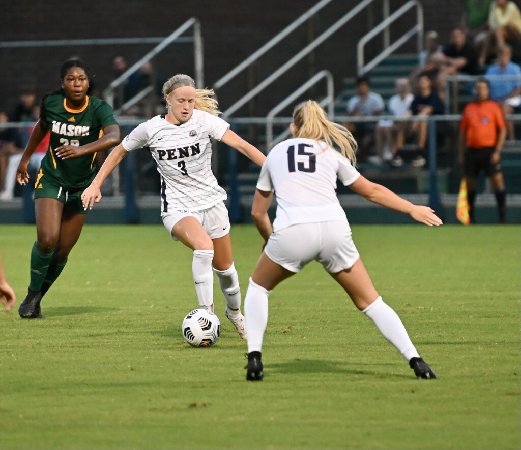 Sophomore Lauren Teuschl dribbles the ball down the field against George Mason.