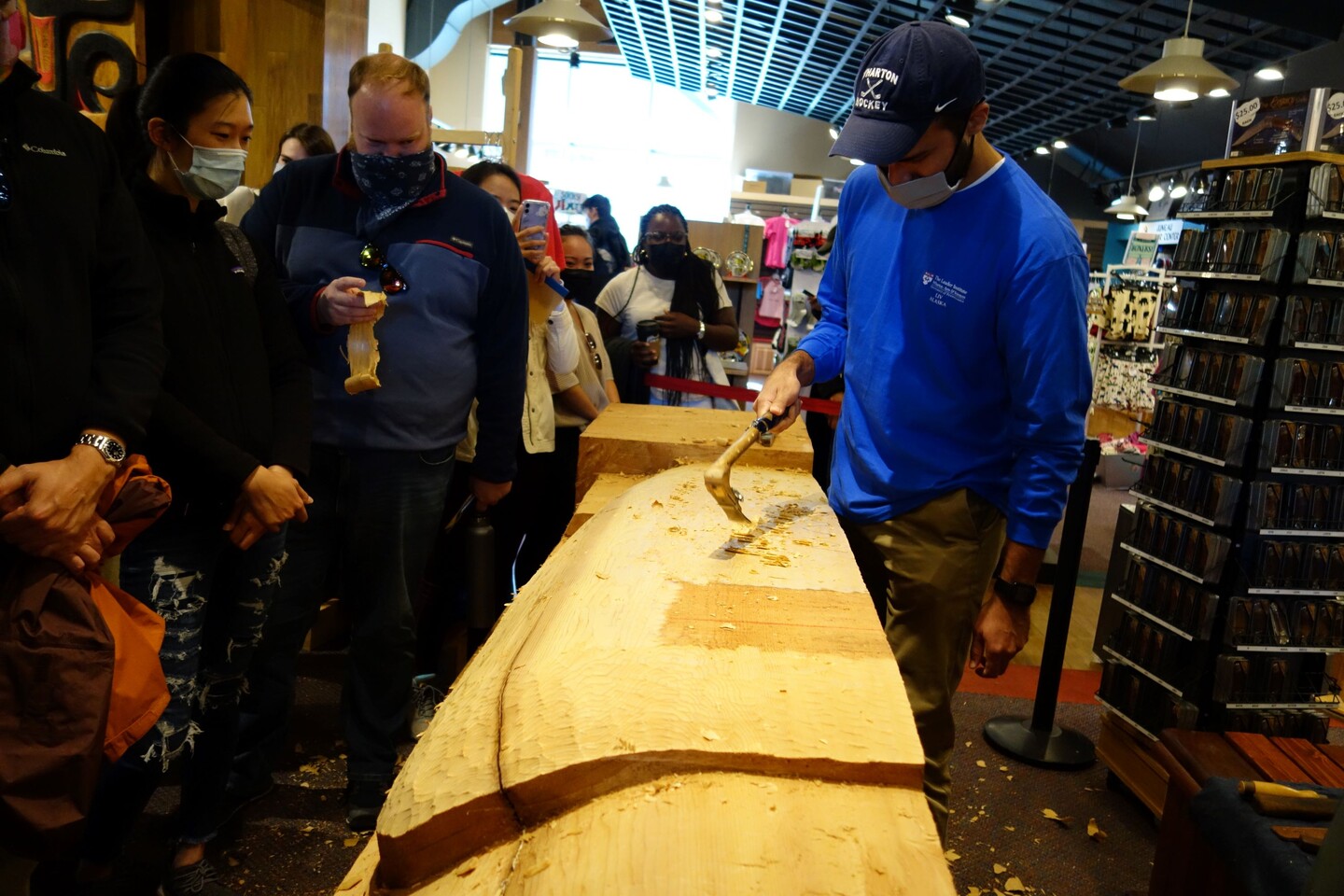 Man chipping away at wood