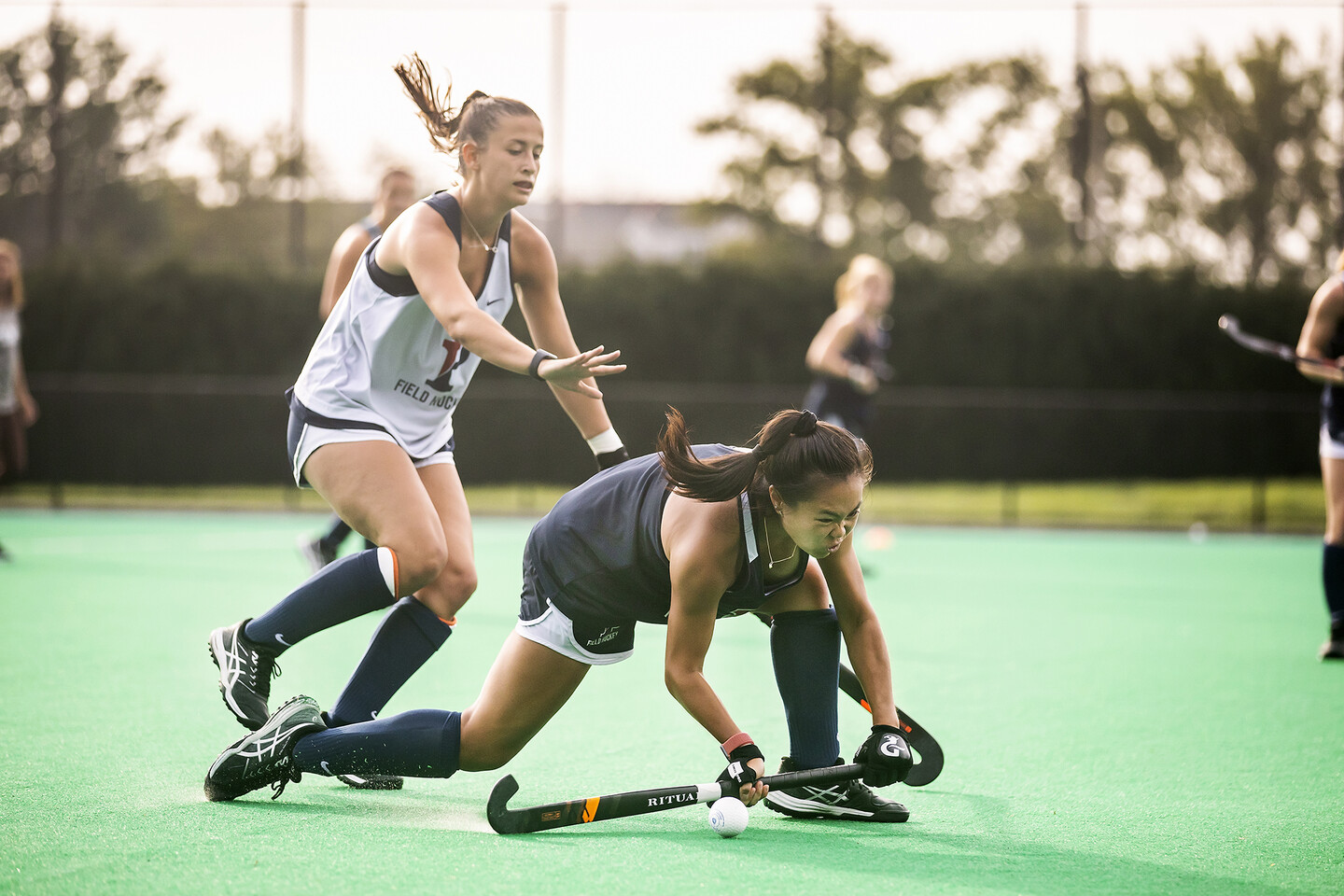 Two players battle for the ball during a practice drill at Vagelos Field.