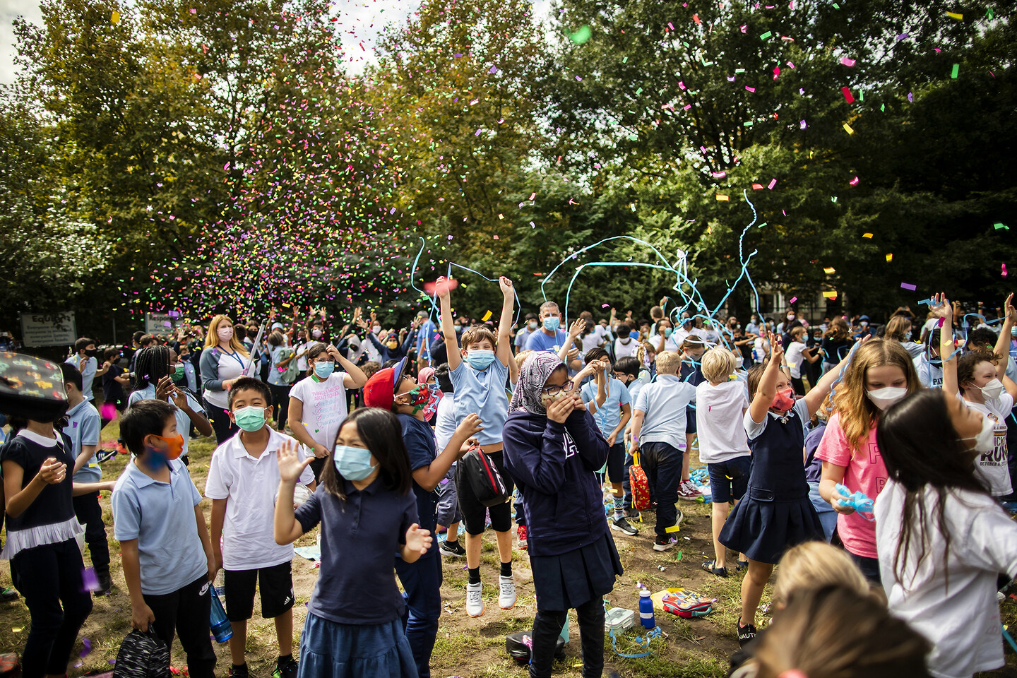 Kids and confetti on lawn