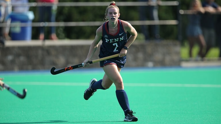Freshman midfielder/defender Courtney Kenah runs with her stick.