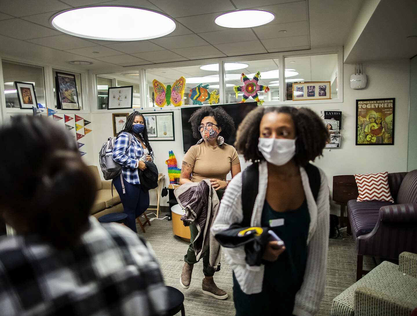 A group of masked people in La Casa Latina