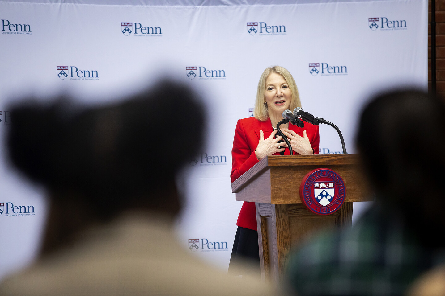 President Amy Gutmann speaking at podium