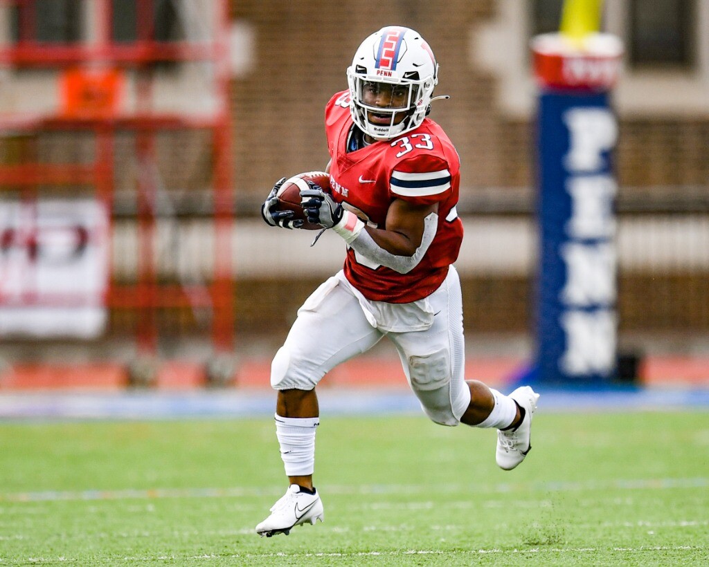 Running back Isaiah Malcome runs in the open field.