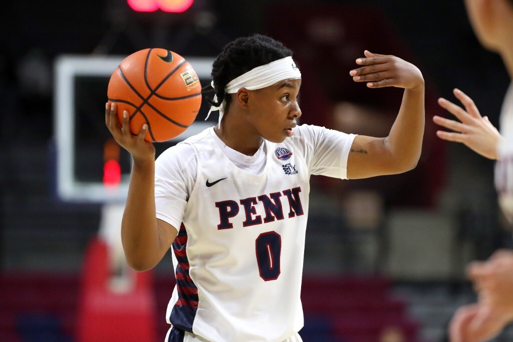 Sophomore forward Jordan Obi signals to a teammate while holding the ball.
