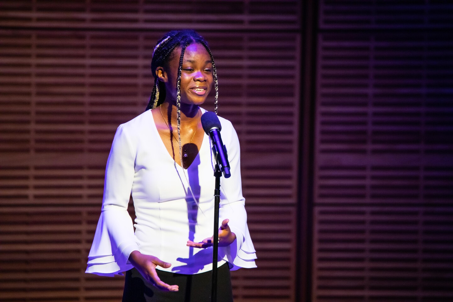 student speaking on stage 