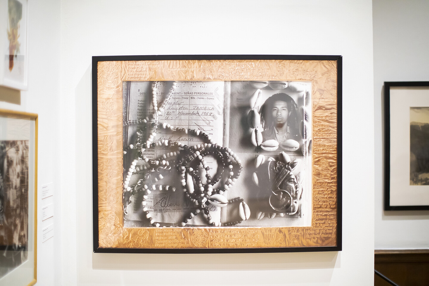 photograph of artist and beads and passport