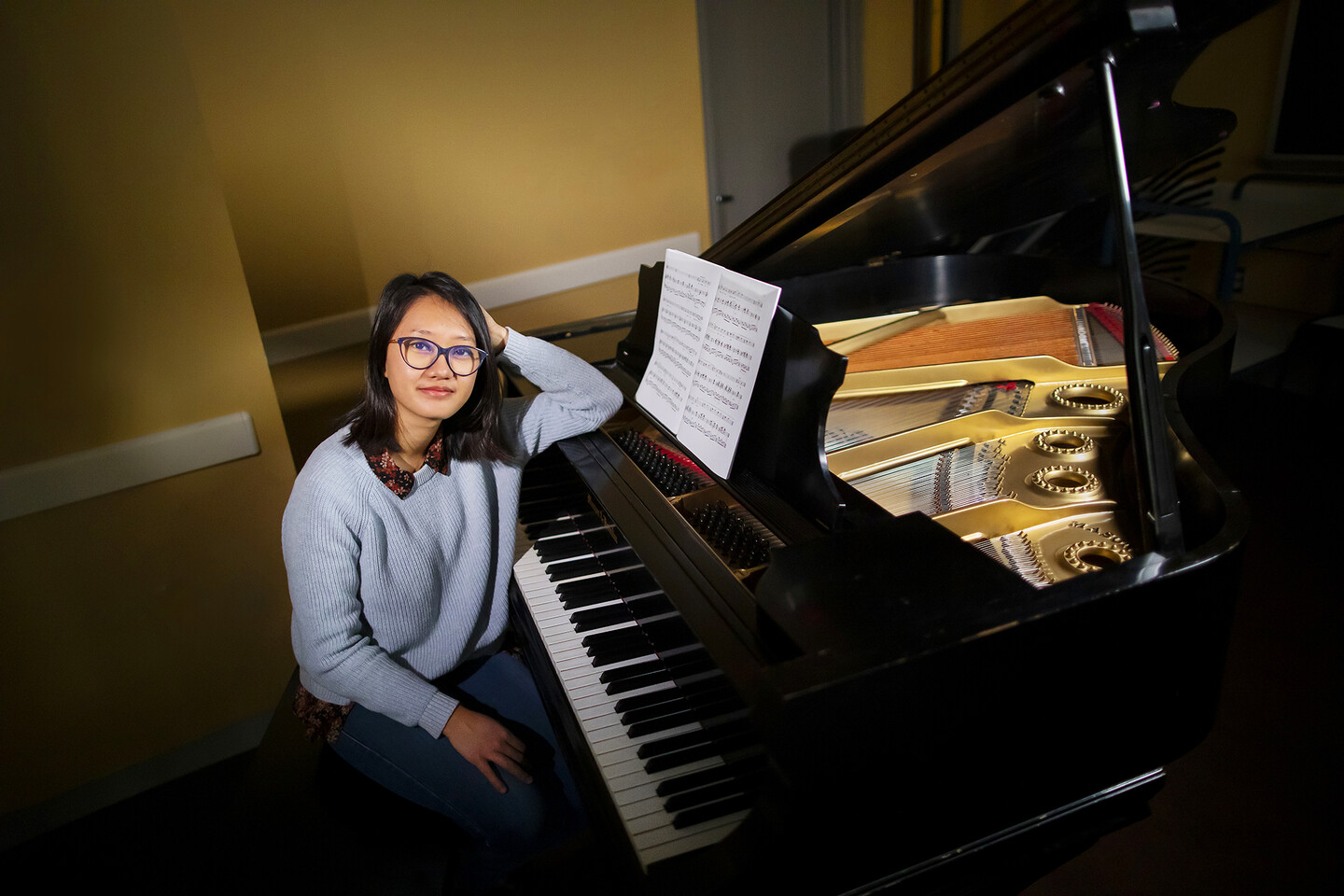 student at a grand piano