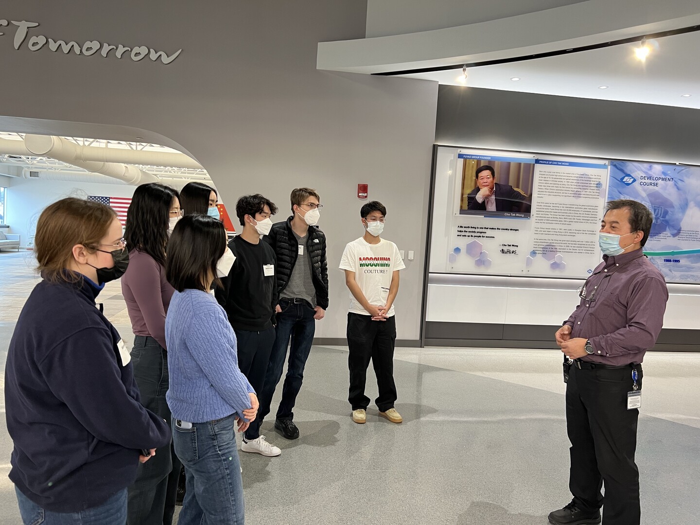 Penn students politely standing for a facility tour