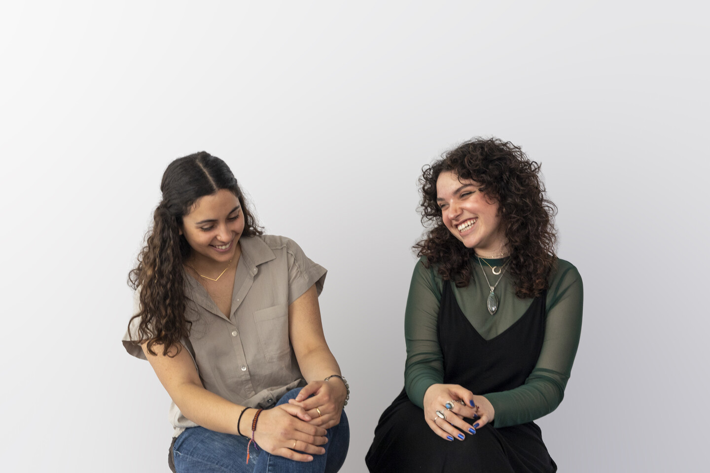 Eleanor Shemtov and Adrianna Brusie sitting and laughing 