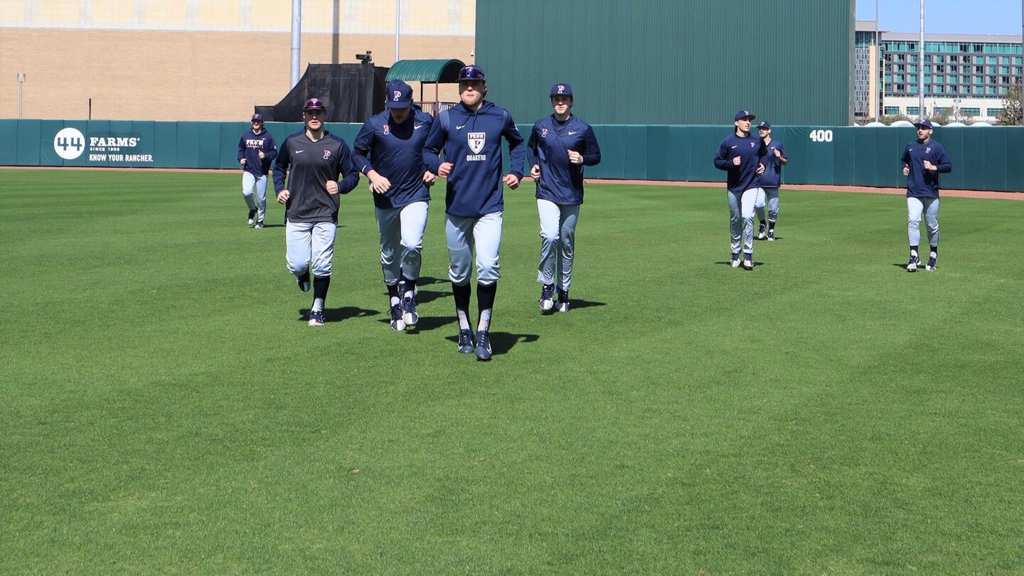Baseball players take the field.