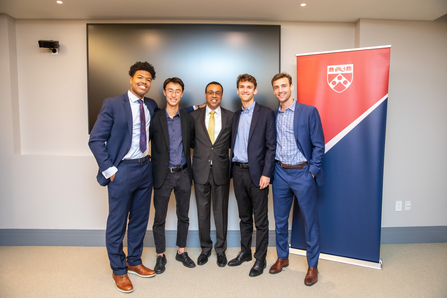 From left, Niko Simpkins, Seungkwon Son, Interim Penn President Wendell Pritchett, Max Strickberger, and Sam Strickberger.