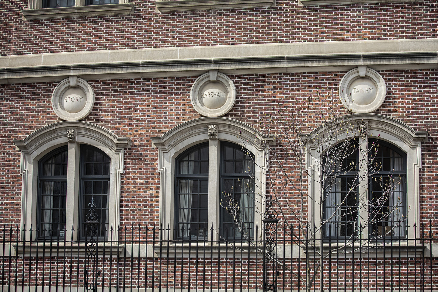 The exterior of Silverman Hall and it's decorative limestone shields and medallions bearing the last names of legal luminaries.