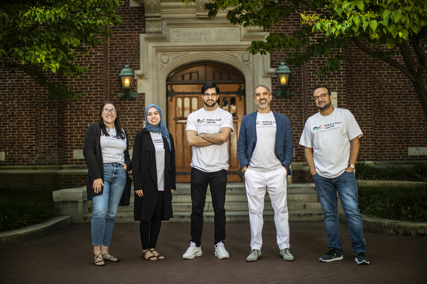 Members of the Middle East Center team stand in front of Fisher-Bennett Hall