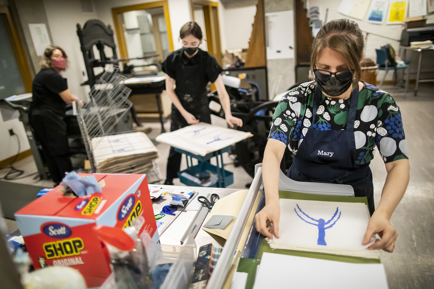 Mary Tasillo printing a page with part of a tree drawing