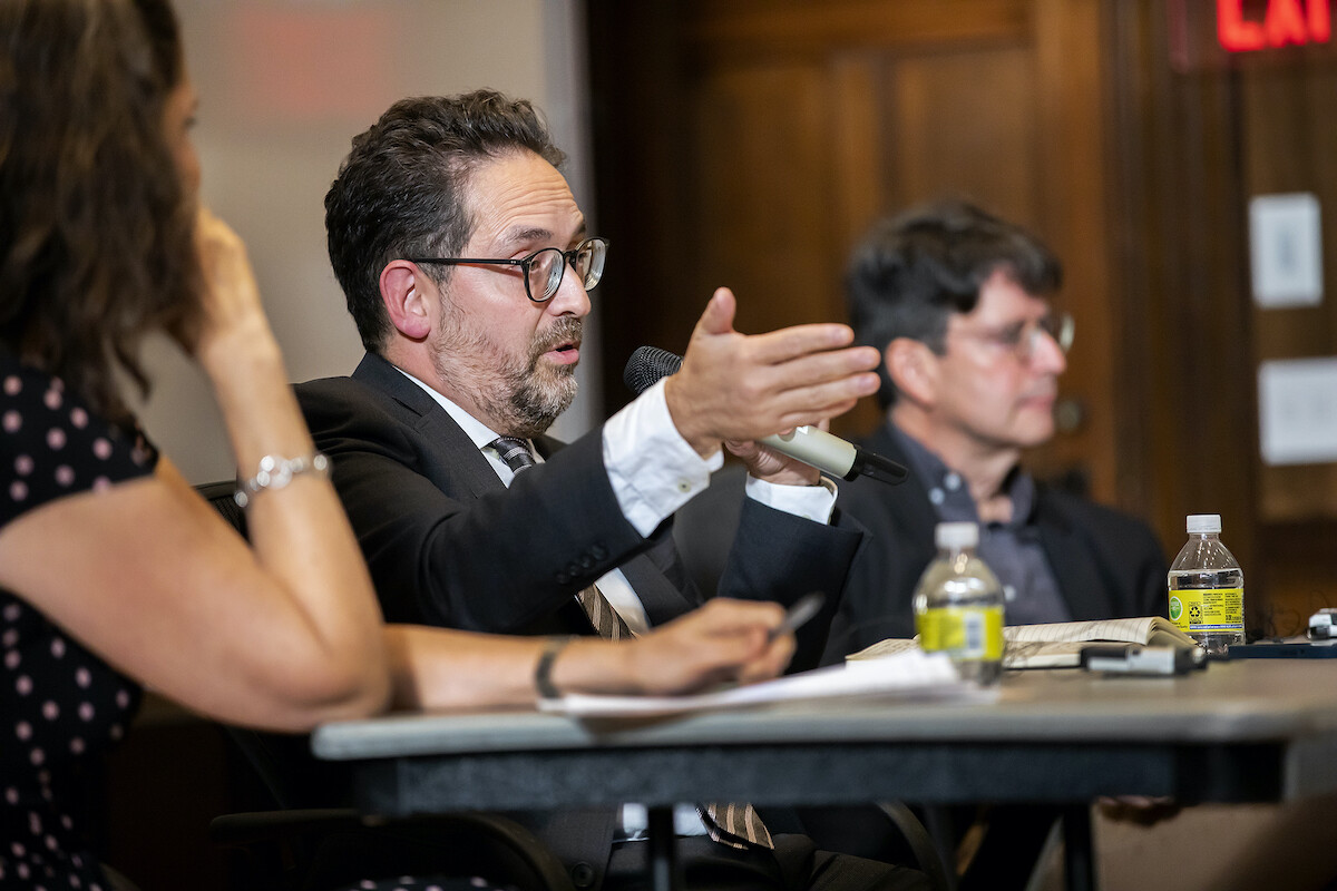 Geraldo Cadava, author of The Hispanic Republican, holds a microphone and gestures as he speaks