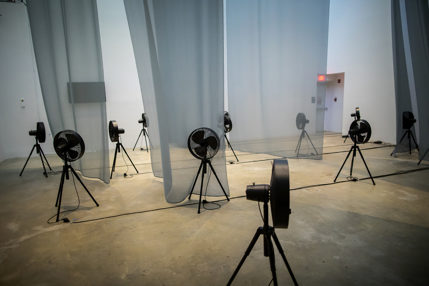 Fans and curtains placed in a gallery