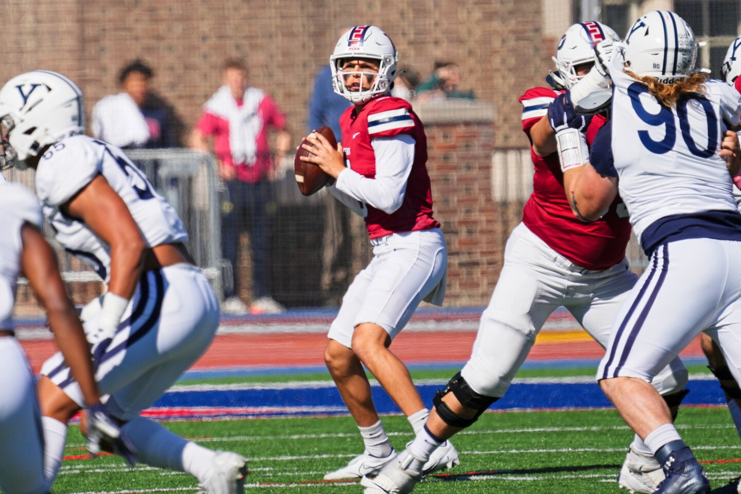 Second-year quarterback Aidan Sayin drops back to pass in the pocket.