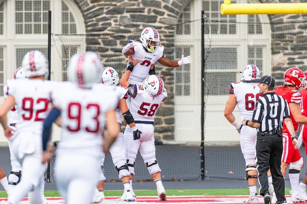 Flowers and an offensive lineman celebrate after a touchdown.