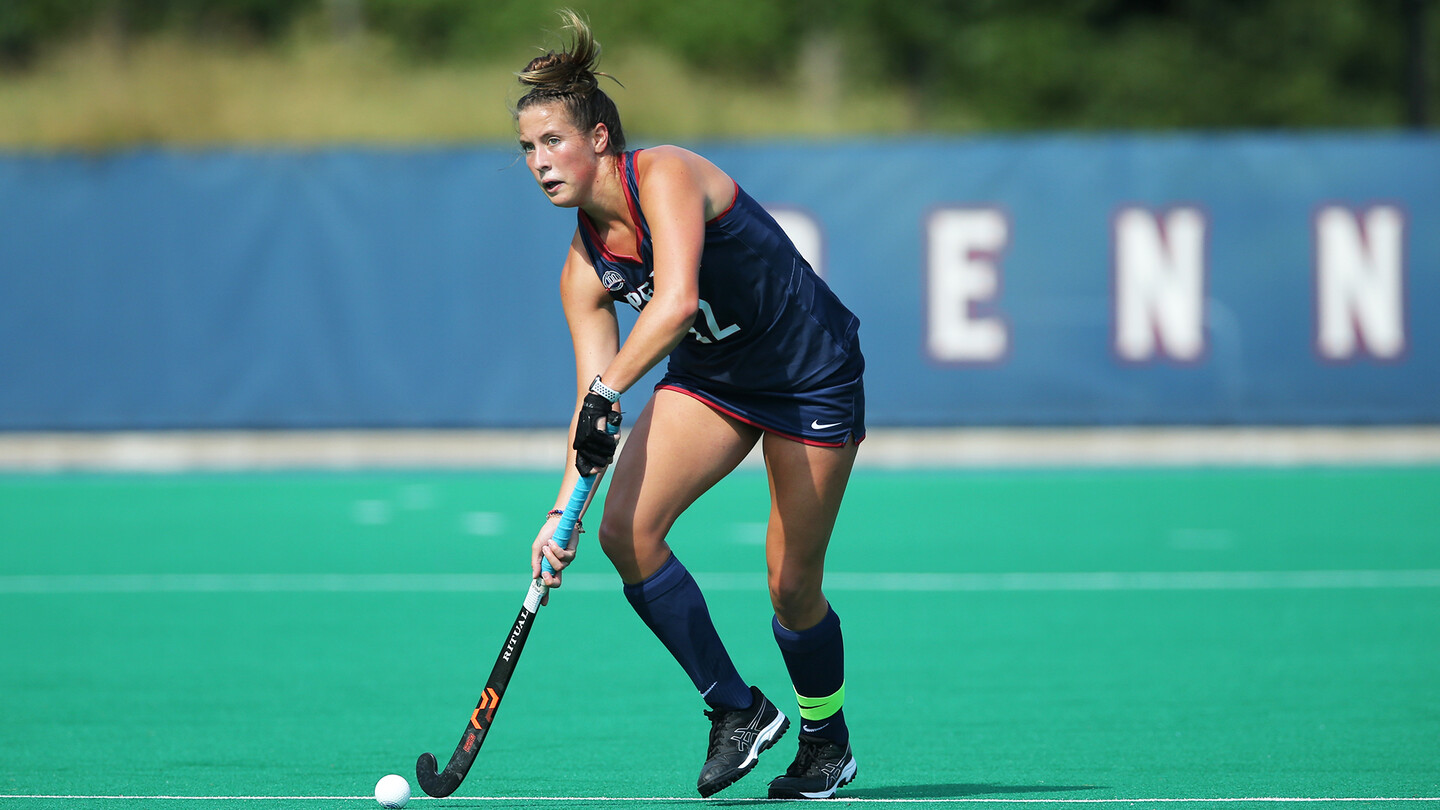 Banks moves the ball with her stick during a game.
