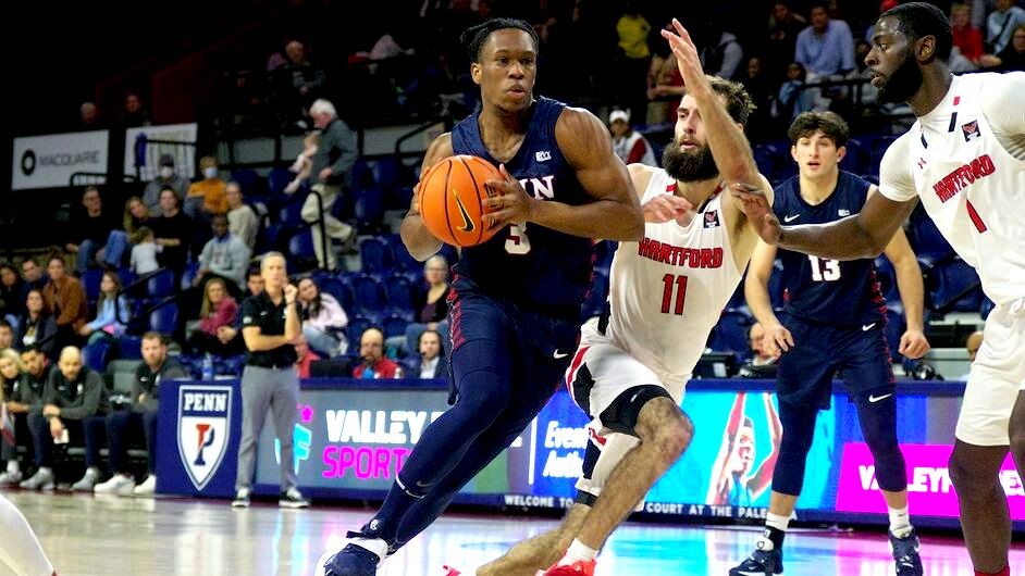 Dingle drives to the basket against Hartford.