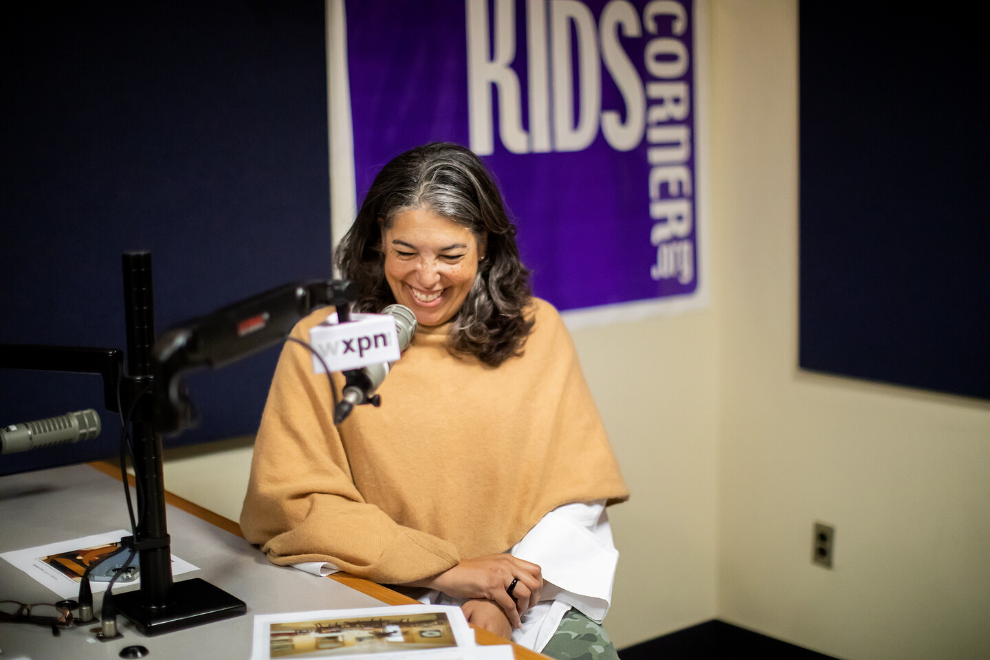 Gwendolyn DuBois Shaw laughing at the microphone
