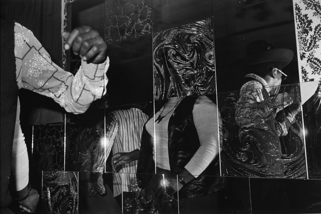 Distorted visions of people in a grid-like mirror
