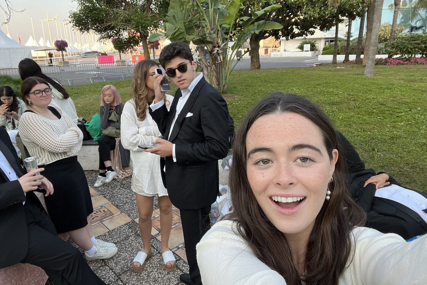 Isabel Sweeney taking a selfie with other students in line